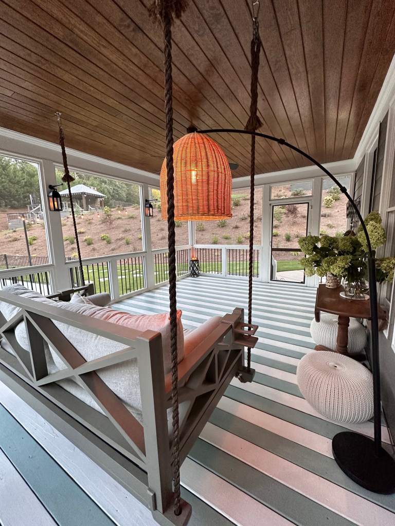 Screened porch, painted floor, side view, lanterns, floor lamp 